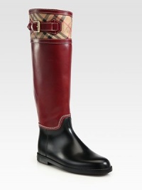Rainy-weather essential in leather with a traditional Burberry print, featuring adjustable buckle hardware and contrast stitching. Stacked rubber heel, 1 (25mm)Shaft, 15¾Leg circumference, 14½Rubber and leather upperLeather liningRubber solePadded insoleImportedOUR FIT MODEL RECOMMENDS ordering true whole size; ½ sizes should order the next whole size up. Rainy-weather essential in leather with a traditional Burberry print, featuring adjustable buckle hardware and contrast stitching. Stacked rubber heel, 1 (25mm)Shaft, 15¾Leg circumference, 14½Rubber and leather upperLeather liningRubber solePadded insoleImportedOUR FIT MODEL RECOMMENDS ordering true whole size; ½ sizes should order the next whole size up.
