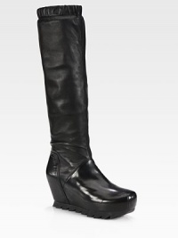 A rubber saw sole upgrades this ultra-tall leather design with a side zip and ruched elastic top. Self-covered wedge, 4 (100mm)Hidden platform, 2½ (65mm)Compares to a 1½ heel, (40mm)Shaft, 16Leg circumference, 11½Leather upperSide zipLeather liningRubber saw solePadded insoleImported A rubber saw sole upgrades this ultra-tall leather design with a side zip and ruched elastic top. Self-covered wedge, 4 (100mm)Hidden platform, 2½ (65mm)Compares to a 1½ heel, (40mm)Shaft, 16Leg circumference, 11½Leather upperSide zipLeather liningRubber saw solePadded insoleImported