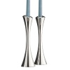 Nambé Aquila candlesticks. Sculptural and free flowing, a gently turning spiral distinguishes the pieces in this collection, created by celebrated designer Lou Henry for Nambé. Introduced in Spring 2008, these tall slender candlesticks are perfectly crafted of Nambé signature alloy. A great set at the dinner table when paired with matching Aquila dinnerware, they also stand in bold confidence all on their own.
