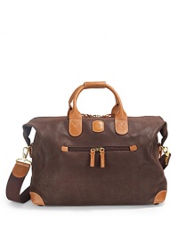 THE LOOKClassic duffel shapeLeather double top handlesRemovable webbed cotton shoulder strapRemovable luggage tagTop zip closureOne outside zip pocketSide snapsProtective feetOne inside zip pocketTHE MEASUREMENTDouble top handles, 5 dropRemovable, adjustable shoulder strap, 13-25 drop23W X 13H X 7DTHE MATERIALPVCLeather trimFully linedORIGINImported THE LOOKClassic duffel shapeLeather double top handlesRemovable webbed cotton shoulder strapRemovable luggage tagTop zip closureOne outside zip pocketSide snapsProtective feetOne inside zip pocketTHE MEASUREMENTDouble top handles, 5 dropRemovable, adjustable shoulder strap, 13-25 drop23W X 13H X 7DTHE MATERIALPVCLeather trimFully linedORIGINImported