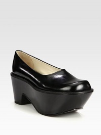 Opt for a lifted yet comfortable leather style with this easy, slip-on wedge silhouette. Self-covered wedge, 3 (75mm)Covered platform, 2½ (65mm)Compares to a ½ heel (15mm)Leather upperLeather lining and solePadded insoleImported Opt for a lifted yet comfortable leather style with this easy, slip-on wedge silhouette. Self-covered wedge, 3 (75mm)Covered platform, 2½ (65mm)Compares to a ½ heel (15mm)Leather upperLeather lining and solePadded insoleImported