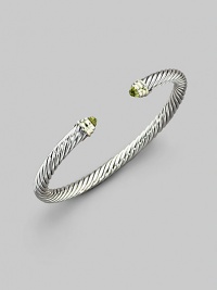 From the Color Classics Collection. The signature Yurman cable, in a graceful bangle capped with faceted peridot domes and accents of 14k gold. Peridot Sterling silver and 14k yellow gold Cable, 5mm Diameter, about 2¼ Imported From the Color Classics Collection. The signature Yurman cable, in a graceful bangle capped with faceted peridot domes and accents of 14k gold. Peridot Sterling silver and 14k yellow gold Cable, 5mm Diameter, about 2¼ Imported