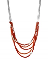 Make your presence known. Kenneth Cole New York's chic statement necklace features several rows of red and silver tone seed beads. Set in silver tone mixed metal. Approximate length: 16 inches + 3-inch extender. Approximate drop: 2 inches. Make your presence known. Kenneth Cole New York's chic statement necklace features several rows of red and silver tone seed beads. Set in silver tone mixed metal. Approximate length: 16 inches + 3-inch extender. Approximate drop: 2 inches.