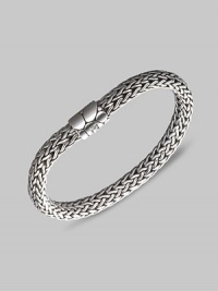 From the Kali Collection. An intricately woven strand of sterling silver with a textured barrel clasp. Sterling silver Length, about 7½ Push-lock clasp Made in Bali. From the Kali Collection. An intricately woven strand of sterling silver with a textured barrel clasp. Sterling silver Length, about 7½ Push-lock clasp Made in Bali.