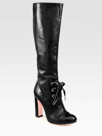 Redefine strong femininity wearing this impeccably crafted leather boot, with sumptuous velvet laces and a tall heel. Self-covered heel, 4 (100mm)Shaft, 15½Leg circumference, 13½Leather upper with velvet lacesSide zipLeather lining and solePadded insoleMade in ItalyOUR FIT MODEL RECOMMENDS ordering true size. Redefine strong femininity wearing this impeccably crafted leather boot, with sumptuous velvet laces and a tall heel. Self-covered heel, 4 (100mm)Shaft, 15½Leg circumference, 13½Leather upper with velvet lacesSide zipLeather lining and solePadded insoleMade in ItalyOUR FIT MODEL RECOMMENDS ordering true size.
