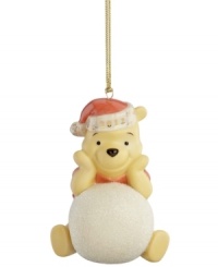It's a snow day for Winnie the Pooh in this adorable porcelain ornament bearing the beloved Disney character. A dated Santa hat makes him extra irresistible. It's a snow day for Winnie the Pooh in this adorable porcelain ornament bearing the beloved Disney character. A dated Santa hat makes him extra irresistible.