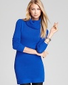 Envelop yourself in luxurious cashmere with this ultra-soft Theory sweater--a tunic-style turtle in a bold blue hue.