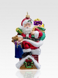 A sparkling Santa gets ready to deliver his goodies in this chic keepsake, rendered in exquisite mouthblown and hand-painted glass.Hand-painted glass5 highImported A sparkling Santa gets ready to deliver his goodies in this chic keepsake, rendered in exquisite mouthblown and hand-painted glass.Hand-painted glass5 highImported