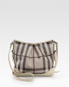 Chic Burberry check PVC, shaped by soft pleats in a slouchy carryall, finished with rich calfskin trim.Adjustable crossbody strap, 19-22½ dropTop zip closureOne inside zip pocketTwo inside open pocketsCotton lining12W X 10H X 1/2DImported