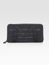 Sturdy cotton canvas with signature M banding at the front and back, finished with stenciled logo lettering.Zip-around closure One inside zip pocket Three bill compartments Eight credit card slots Cotton lining 7¾W X 4H X 1D Imported Sturdy cotton canvas with signature M banding at the front and back, finished with stenciled logo lettering.Zip-around closure One inside zip pocket Three bill compartments Eight credit card slots Cotton lining 7¾W X 4H X 1D Imported
