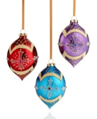 In a classic teardrop silhouette, this set of three ornaments adds a layer of sparkle to your tree with luxe gold glitter and a traditional cross design. In a classic teardrop silhouette, this set of three ornaments adds a layer of sparkle to your tree with luxe gold glitter and a traditional cross design.