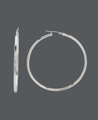 Celebrities and fashionistas alike can all embrace the hoop trend. For all-enduring style, snap up these statement-making large hoops crafted in a polished 14k white gold setting. Approximate diameter: 2-1/4 inches.