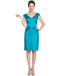 Super sleek: Seamed detail and shiny, lustrous fabric make this Maggy London dress unforgettable for evening. Super sleek: Seamed detail and shiny, lustrous fabric make this Maggy London dress unforgettable for evening.