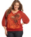 Fall for florals this season with Style&co.'s three-quarter-sleeve plus size top, punctuated by a smocked hem.