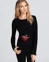 Bring whimsy to your wardrobe with this luxe Sonia Rykiel sweater, adorned with a brightly feathered bird.