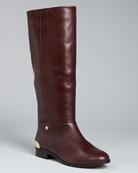 These riding boots are emboldened with golden trim, ready for stepping out stylishly 24/7; from Cynthia Vincent. These riding boots are emboldened with golden trim, ready for stepping out stylishly 24/7; from Cynthia Vincent.