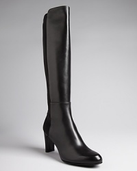 Stuart Weitzman's 5050 design is incredibly popular for a reason: its beautifully polished leather shafts fit perfectly thanks to stretch backs. Stuart Weitzman's 5050 design is incredibly popular for a reason: its beautifully polished leather shafts fit perfectly thanks to stretch backs.