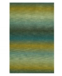 Crafted with an eye-catching ombre effect -- in which colors blend gradually into one another -- this hand-tufted area rug from Liora Manne has an organic flow that adds visual interest and irresistible allure to any floor. Crafted with an eye-catching ombre effect -- in which colors blend gradually into one another -- this hand-tufted area rug from Liora Manne has an organic flow that adds visual interest and irresistible allure to any floor.