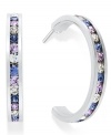 Traditions gives a sparkling boost to a simple pair of hoop earrings. A channel-set row of round-cut purple and blue Swarovski crystals shines within a sterling silver setting. Earrings feature a post and stud backing. Approximate diameter: 3/4 inch.
