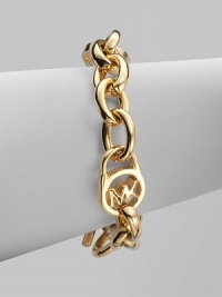 A radiant goldtone design with an iconic logo embellished lock on a chain link. Goldtone metalLength, about 8Toggle closureImported A radiant goldtone design with an iconic logo embellished lock on a chain link. Goldtone metalLength, about 8Toggle closureImported