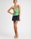 Colorblocked silk charmeuse in a strapless one-piece, easy-fit with a flirty ruffle at the waist.Top-fit bodiceElastic waistGathered shortsMesh back panelCenter back zipperRise, about 10Inseam, about 495% silk/5% spandexDry cleanMade in USAModel shown is 5'10 (177cm) wearing US size 4.
