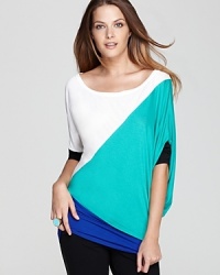 This BCBGMAXAZRIA top approaches style from a different angle, with diagonal color blocking and side draping that's right on. This BCBGMAXAZRIA top approaches style from a different angle, with diagonal color blocking and side draping that's right on.
