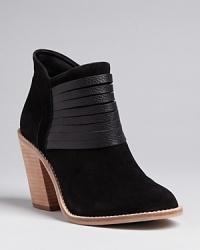 Wrap up the Western look in these ultra-chic Loeffler Randall booties, with strappy accents and stacked, cowgirl-style heels. Wrap up the Western look in these ultra-chic Loeffler Randall booties, with strappy accents and stacked, cowgirl-style heels.