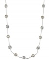 Get stranded in style with this captivating Anne Klein necklace. Embellished with sparkling glass stones and plastic pearls on a silvery strand. Set in silver tone imitation rhodium mixed metal. Approximate length: 16 inches.