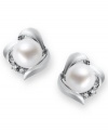 A simple, sophisticated touch. These petite knot-shaped stud earrings feature a cultured freshwater pearl (7 mm) and sparkling diamond accents at the sides. Set in sterling silver. Approximate diameter: 3/8 inch.