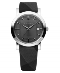 This Burberry timepiece features a dark gray beat check cloth strap and round stainless steel case. Dark gray etched dial with silvertone stick indices, logo and date window. Swiss made. Swiss movement. Water resistant to 50 meters. Two-year limited warranty. This Burberry timepiece features a dark gray beat check cloth strap and round stainless steel case. Dark gray etched dial with silvertone stick indices, logo and date window. Swiss made. Swiss movement. Water resistant to 50 meters. Two-year limited warranty.