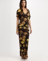 A gorgeous floral print with a curve-hugging maxi-dress fit creating a stunning and elongating coverup. V-neckShort sleevesPull-on style87% nylon/13% spandexHand washImported