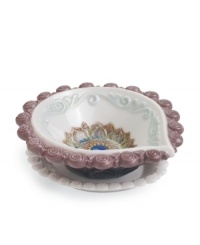 Decorate for Diwali, then enjoy the unparalleled grace of Lladro porcelain all year long with this handcrafted diya. With a colorful floral motif and swirls of purple and aqua. Decorate for Diwali, then enjoy the unparalleled grace of Lladro porcelain all year long with this handcrafted diya. With a colorful floral motif and swirls of purple and aqua.