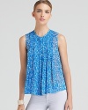 Pretty pleats add ladylike charm to this breezy DIANE von FURSTENBERG top in pure silk.