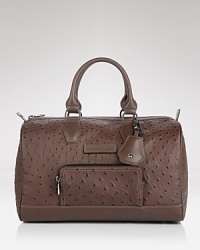 Crafted of rich leather with carry-it-all credentials-it's a first class travel bag with a dash of Parisian charm. From Longchamp. Crafted of rich leather with carry-it-all credentials-it's a first class travel bag with a dash of Parisian charm. From Longchamp.