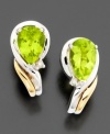 Bright and brilliant pear-shaped peridot (1-5/8 ct. t.w.) is at its element in these earrings with round-cut diamond accents set in 14k gold & sterling silver. Approximate length: 1/2 inches.