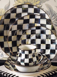 A charming way to add color and personality to the dinner table, crafted in a checkerboard juxtaposition of ivory and onyx with bronzed stainless steel trim. Enameled steel 12 diam. Dishwasher safe Made in USA A charming way to add color and personality to the dinner table, crafted in a checkerboard juxtaposition of ivory and onyx with bronzed stainless steel trim. Enameled steel 12 diam. Dishwasher safe Made in USA