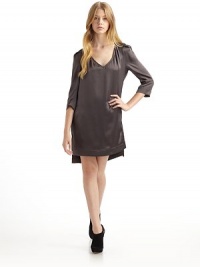 THE LOOKPebbled silk satin with V-necklineEpualettesPleated shoulder capsThree-quarter length sleevesBack button-and-loop closureBack slit from neck to waistSide slit rugby hem Fully linedTHE FITAbout 36½ from shoulder to longest point of hemTHE MATERIALSilkCARE & ORIGINDry cleanImportedOUR FIT MODEL RECOMMENDS ordering one size up as this style runs small. THE LOOKPebbled silk satin with V-necklineEpualettesPleated shoulder capsThree-quarter length sleevesBack button-and-loop closureBack slit from neck to waistSide slit rugby hem Fully linedTHE FITAbout 36½ from shoulder to longest point of hemTHE MATERIALSilkCARE & ORIGINDry cleanImportedOUR FIT MODEL RECOMMENDS ordering one size up as this style runs small.