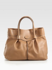 A well-crafted, supple leather style with contrast edges and feminine pleated details.Double top handles, 6 dropMagnetic snap closureOne inside zip pocketTwo inside open pocketsSatin lining12W X 11H X 5DImported