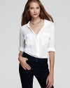 This James Perse shirt puts a chicer spin on the classic white button down with double pockets and an asymmetrical hem.