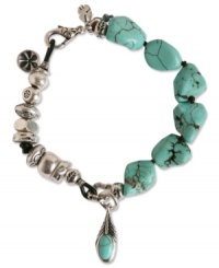Totally charmed. Crafted from chic silver tone mixed metal and semi-precious turquoise stones, this bohemian-inspired bracelet from Lucky Brand lends a look that's elegant and easy going. Approximate length: 7-5/8 inches. Totally charmed. Crafted from chic silver tone mixed metal and semi-precious turquoise stones, this bohemian-inspired bracelet from Lucky Brand lends a look that's elegant and easy going. Approximate length: 7-5/8 inches.