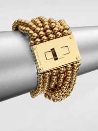 From the Modern Classics Collection. Bold and beautiful strands of polished beads with a glowing golden finish are connected to a striking turn-lock clasp in this sophisticated design.GoldtoneLength, about 7Width, about 1.75Turn-lock claspImported