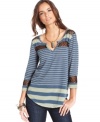 Sheer crochet insets show a hint of skin on this Free People striped top for a sexy spin on a casual basic!