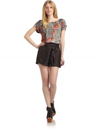 THE LOOKAbstract printPullover styleRound necklineShort cuffed sleevesBack snap closureRibbed hemTHE FITAbout 27 from shoulder to hemTHE MATERIAL70% lyocell/30% linenCARE & ORIGINHand washImportedModel shown is 5'9½ (176cm) wearing US size Small. THE LOOKAbstract printPullover styleRound necklineShort cuffed sleevesBack snap closureRibbed hemTHE FITAbout 27 from shoulder to hemTHE MATERIAL70% lyocell/30% linenCARE & ORIGINHand washImportedModel shown is 5'9½ (176cm) wearing US size Small.