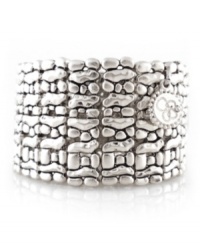 Simple style in head-turning silver. Jessica Simpson's unique cuff bracelet features a textured surface in silver tone mixed metal. Bracelet stretches to fit wrist. Approximate diameter: 2-1/4 inches. Simple style in head-turning silver. Jessica Simpson's unique cuff bracelet features a textured surface in silver tone mixed metal. Bracelet stretches to fit wrist. Approximate diameter: 2-1/4 inches.