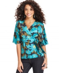 Channel world-traveled style with One World's pretty top, featuring an exotic floral print on a flattering faux wrap silhouette. Channel world-traveled style with One World's pretty top, featuring an exotic floral print on a flattering faux wrap silhouette.