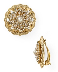 As if unearthed from a socialite's jewel box, this pair of button earrings from Carolee Lux flaunt an heirloom quality with ornate floral and crystal accents. As if unearthed from a socialite's jewel box, this pair of button earrings from Carolee Lux flaunt an heirloom quality with ornate floral and crystal accents.