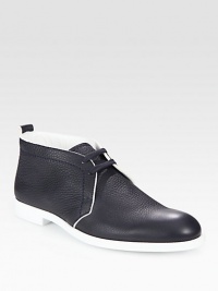 An eye-catching modern silhouette in a trendy two-tone design and pebbled leather. Pebbled calf leather upperLeather liningPadded insoleRubber soleMade in Italy An eye-catching modern silhouette in a trendy two-tone design and pebbled leather. Pebbled calf leather upperLeather liningPadded insoleRubber soleMade in Italy
