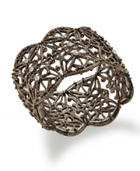 Cuff love. Sparkling crystals and an intricate openwork pattern create a dramatic statement on Style&co.'s chic cuff bracelet. Crafted in bronze. Bracelet stretches to fit wrist. Approximate length: 7-1/4 inches. Cuff love. Sparkling crystals and an intricate openwork pattern create a dramatic statement on Style&co.'s chic cuff bracelet. Crafted in bronze. Bracelet stretches to fit wrist. Approximate length: 7-1/4 inches.