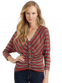 THE LOOKAllover stripesV-neckLong dolman sleevesChain link details down the centerPullover styleTHE FITAbout 22 from shoulder to hemTHE MATERIALRayon/polyesterCARE & ORIGINDry cleanMade in USAModel shown is 5'8 (172½cm) wearing US size Small. THE LOOKAllover stripesV-neckLong dolman sleevesChain link details down the centerPullover styleTHE FITAbout 22 from shoulder to hemTHE MATERIALRayon/polyesterCARE & ORIGINDry cleanMade in USAModel shown is 5'8 (172½cm) wearing US size Small.
