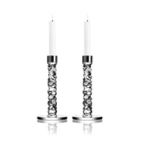 This brilliant pair of candleholders, designed by Lena Bergstrom, was crafted using new techniques that give the look of exquisitely cut diamonds. This brilliant pair of candleholders, designed by Lena Bergstrom, was crafted using new techniques that give the look of exquisitely cut diamonds.